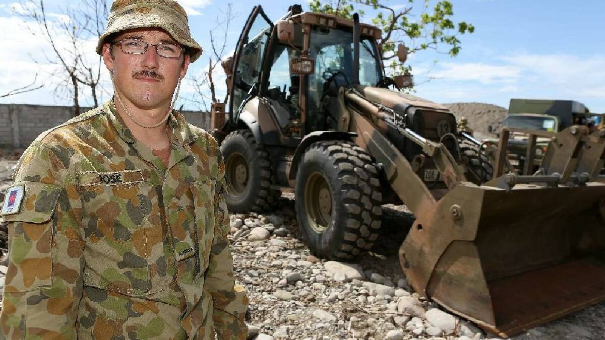 NAROOMA: Pictured in the Philippines, a long way from the home in Narooma, is ADF combat engineer Robert Rose who together with his front loader is helping to clean up after the devastating cyclone. 