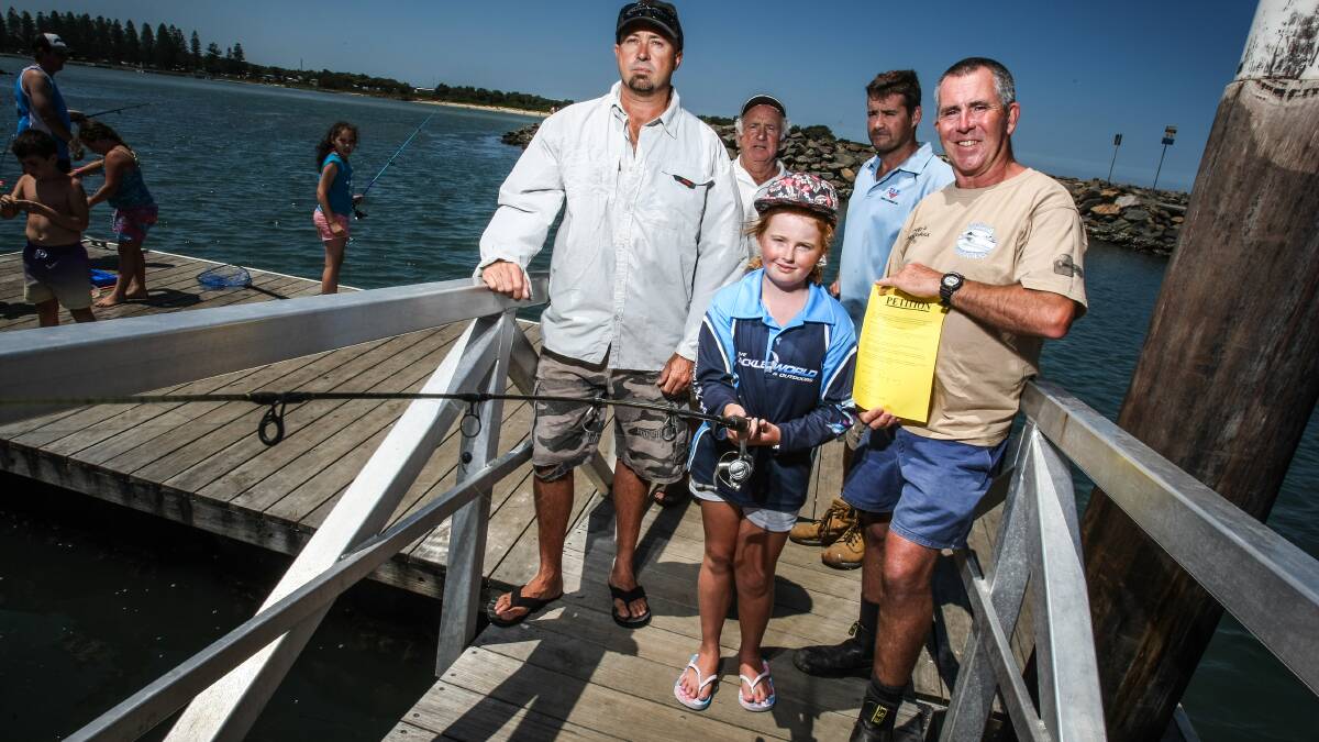 KIAMA: Local fishermen are championing a petition to limit commercial fishing licenses in Lake Illawarra. Pictured are Flint Rimmer, Brian Leach, Hayley Leach, Karl Neels and Andrew Connor. Picture: DYLAN ROBINSON 