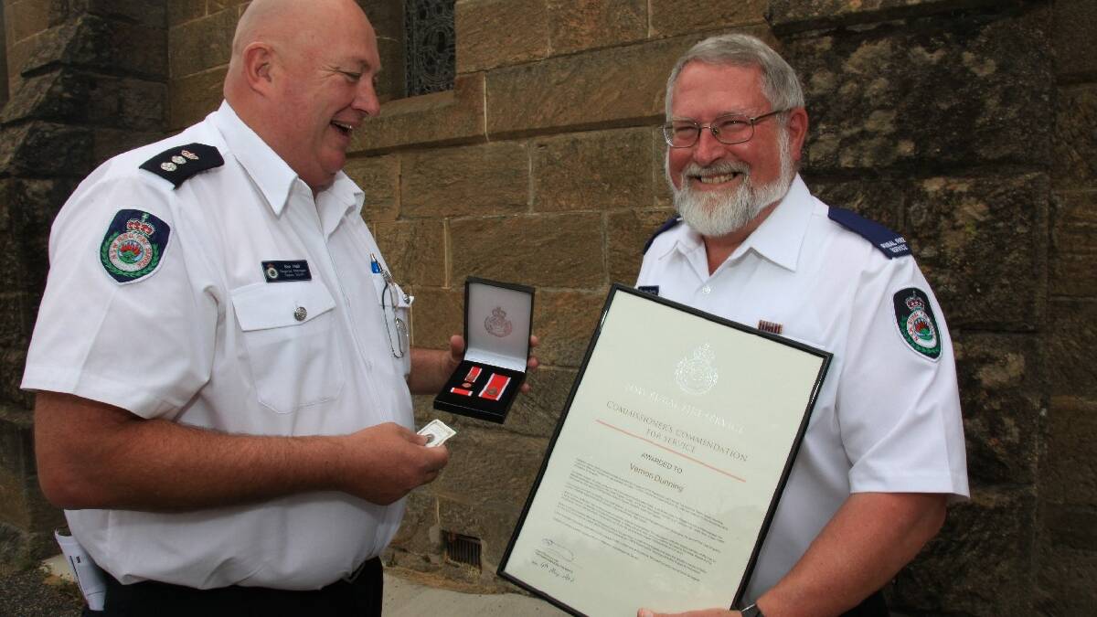 
COOMA: NSW Rural Fire Service Chief Superintendent Ken Hall presents Cooma Rural Fire Service brigade member Vern Dunning with the Commissioners Commendation for Service. Mr Dunning is also Cooma’s Citizen of the Year. (Photo: Monaro Team NSW Rural Fiere Service. 