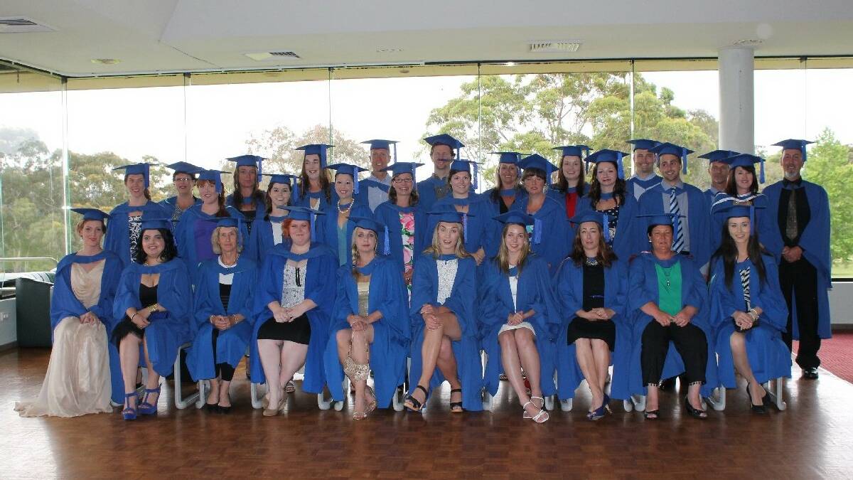 BEGA: University of Wollongong Bega campus graduands gather for a group photo before their graduation ceremony at the Pambula-Merimbula Golf Club. 