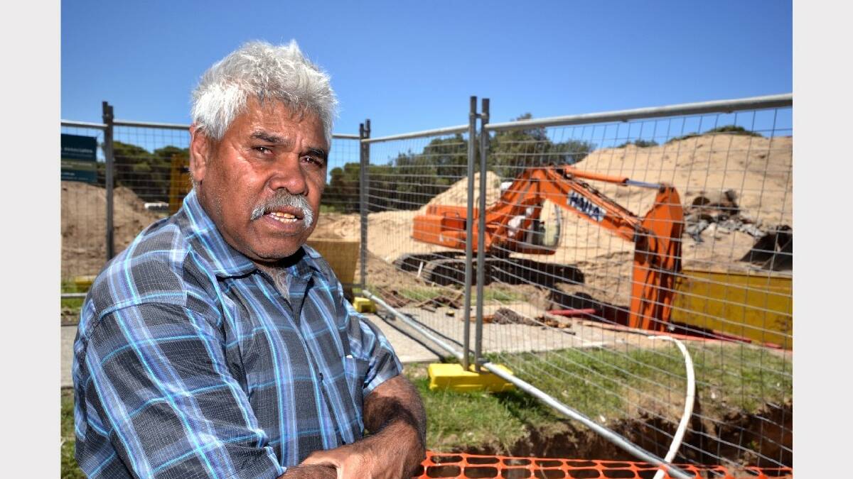NOWRA: Aboriginal elder Graeme Connolly stopped work at a Shoalhaven Heads development site yesterday to highlight he need to protect significant sites. 