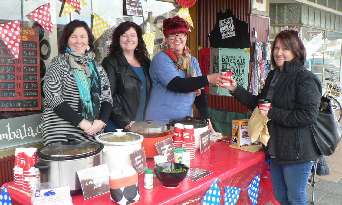 Kelly Heffernan, Rachel Giles and Penny Campbell of ‘Bandicoot’s Long Haul’ team cheerfully served Lana Jamieson during their very popular ‘Sip Some Soup for Cancer’ fundraiser for the Relay for Life on Friday. 
