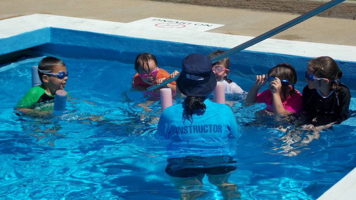 Swim and Survive program instructor, Jordan Shelley teaching some young swimmers at the Bombala Pool.