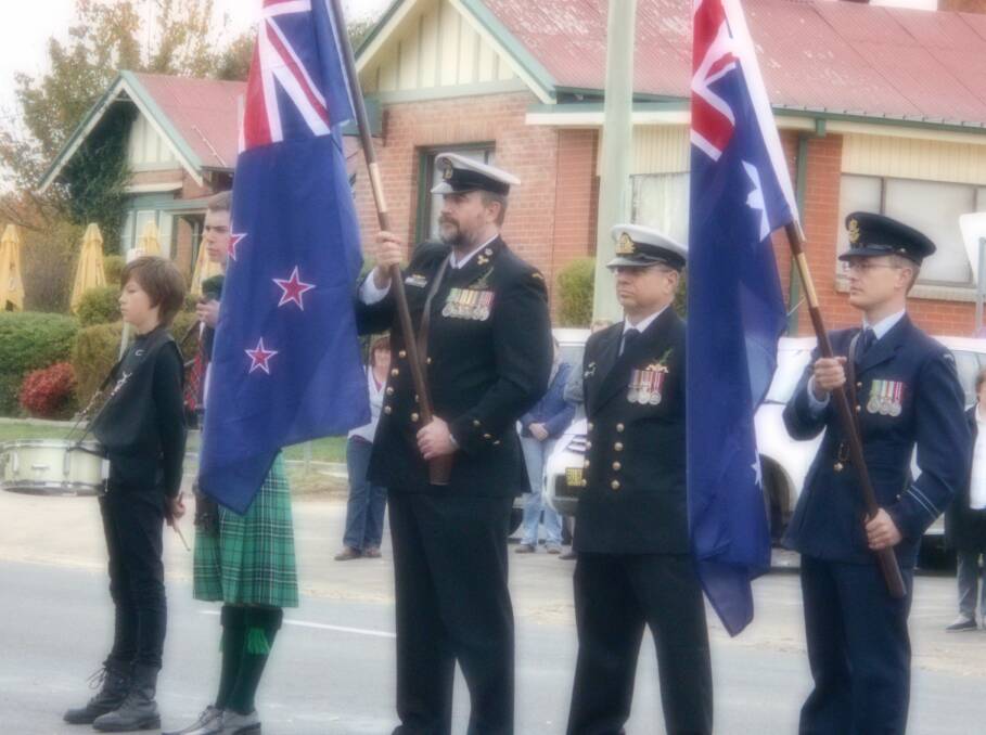Drummer, Noah Cole and piper, Will Horton led the Anzac March in Delegate, accompanied by Armed Forces representatives. 