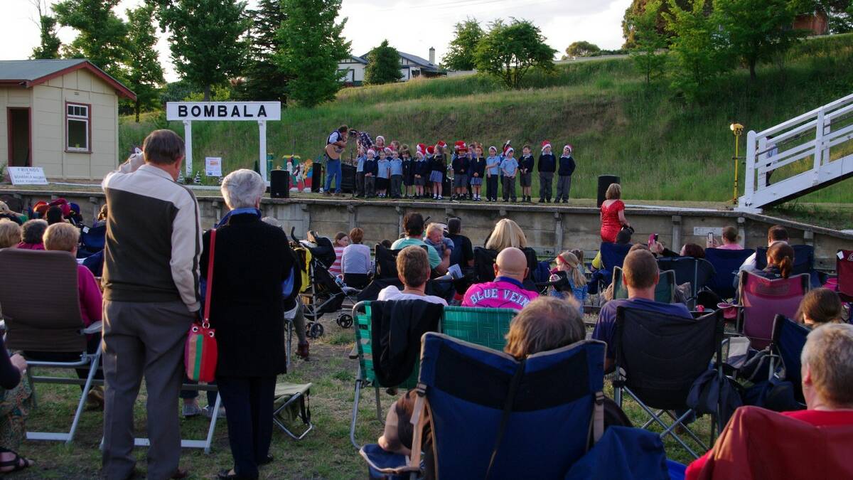 Friends of the Bombala Railway hosted Carols by Candlelight on November 29, with a big crowd gathering to enjoy the sing along, the stalls, the ham raffles and Santa's arrival with a police escort.