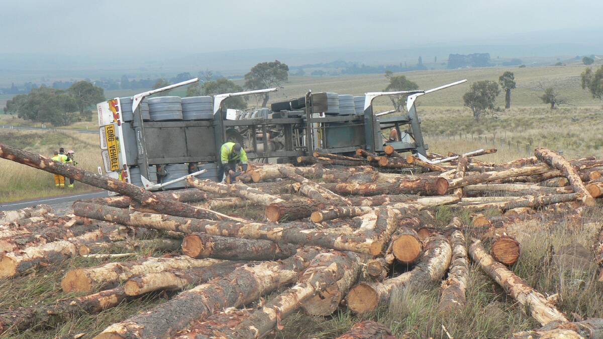 Another truck overturns