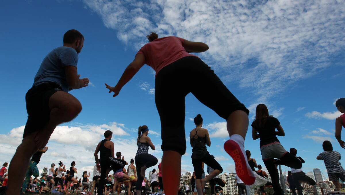 The Biggest Yoga Class event at Rushcutters bay featuring several hundred yoga enthusiasts enjoying the morning air. Photo: Ben Rushton