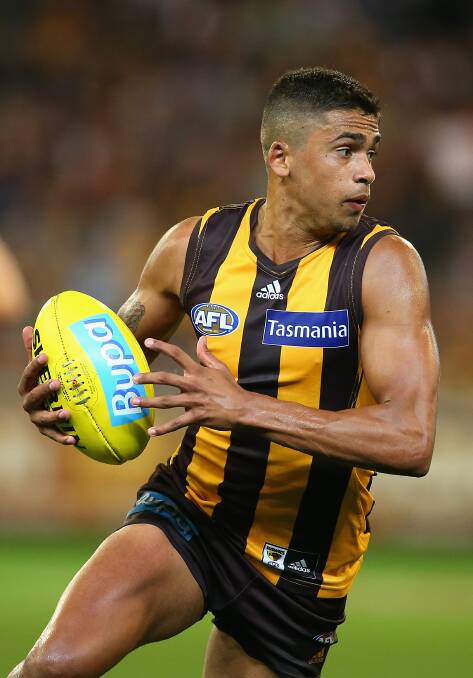 Bradley Hill of the Hawks runs with the ball. The Hawks defeated the visiting Dockers 137-79. Picture: Getty Images