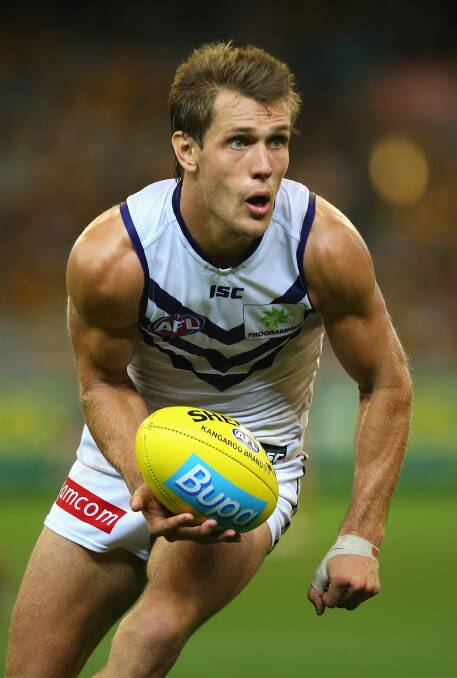 Matt De Boer of the Dockers handballs. The Hawks defeated the visiting Dockers 137-79. Picture: Getty Images