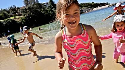 Children enjoy the hot weather at the start of school holidays, playing at Clovelly Beach. Photo: Brendan Esposito