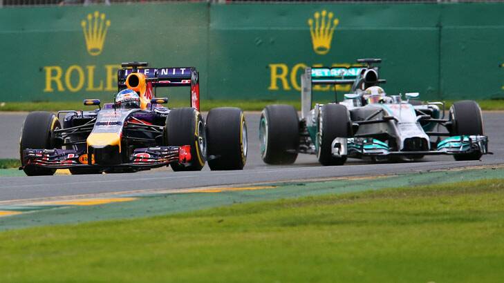 Red Bull's Daniel Ricciardo and Mercedes' Lewis Hamilton in action. Photo: Wayne Taylor