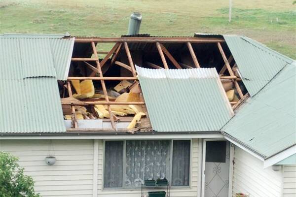 The tornado ripped part of a roof from one home, also smashing a window,