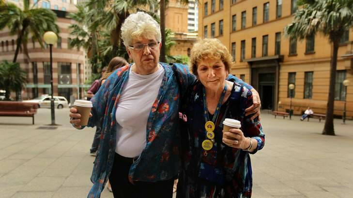 Eyvette Parr comforts  survivor of abuse Trish Charter (right) who was at St Joseph's orphanage in Goulburn, outside the Royal Commission into the Institutional Responses to Child Sexual Abuse public hearing into the response of 'Towards Healing', being held in Sydney. Photo: Kate Geraghty