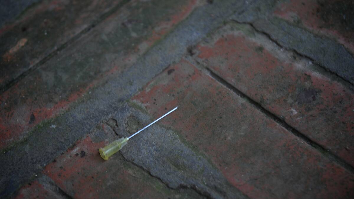 A discarded syringe in the bear's enclosure of an illegal harvesting operation near Hanoi. Photo: BRENDAN McCARTHY/BENDIGO ADVERTISER