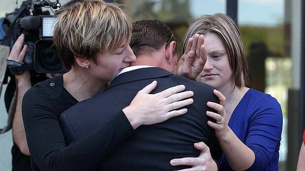 Same-sex couples console one another in Canberra. Photo: Alex Ellinghausen
