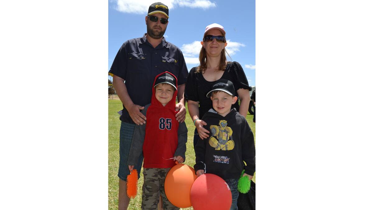 Hayden, Michael, Brad and Jodie Ellbourne, of Aldinga Beach, enjoy the sunshine at the the White Hill Truck Drivers Memorial Remembrance Truck Show at the Murray Bridge Racing Course on Sunday.