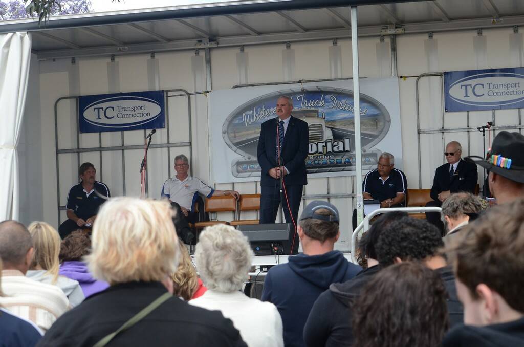 Hammond Member Adrian Pederick speaks to the families, friends and drivers who attended the opening of the truck drivers memorial in Murray Bridge on the weekend.