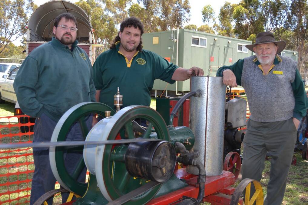 Nick McCue, Jayme Marshall and Bruce Stevens demonstrate some old machinary in action at he White Hill Truck Drivers Memorial Remembrance Truck Show at the Murray Bridge Racing Course on Sunday.
