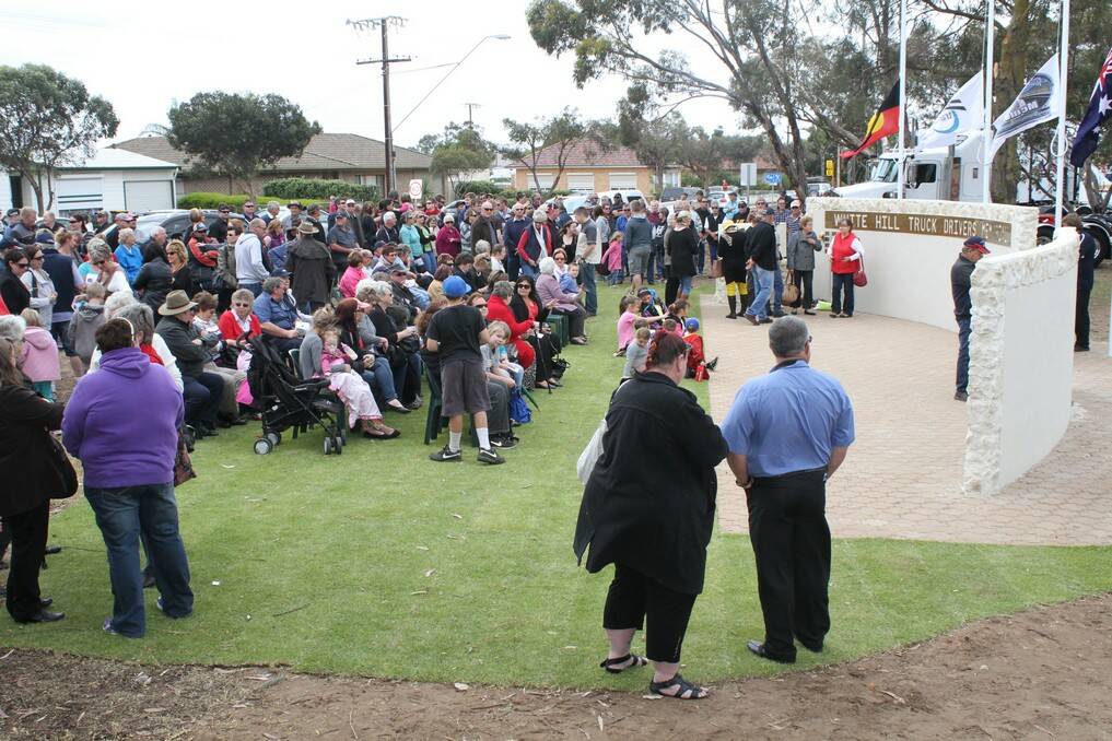 Crowds gather for the opening of the White Hill Truck Drivers Memorial at Murray Bridge. 