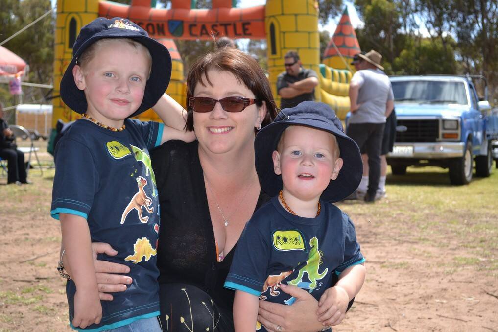 Hayden, Michael, Brad and Jodie Ellbourne, of Aldinga Beach, enjoy the sunshine at the the White Hill Truck Drivers Memorial Remembrance Truck Show at the Murray Bridge Racing Course on Sunday.