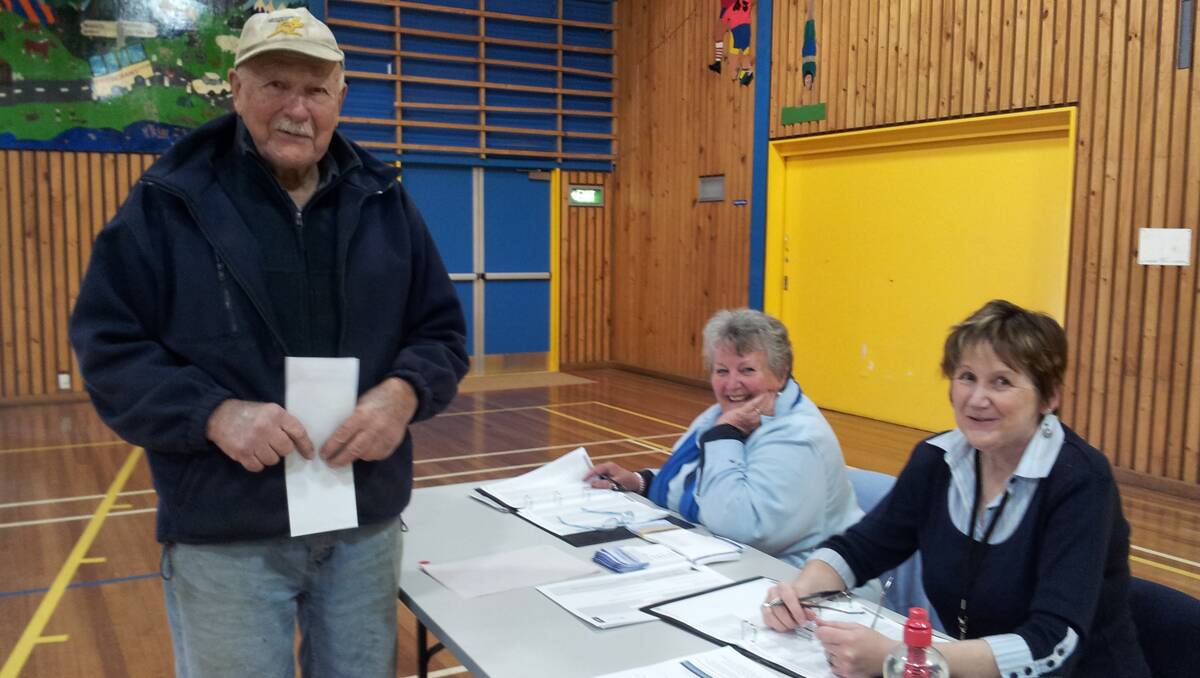 Peter Williams had his name marked off by Kay Coates and Libby Long at the Bombala Council Election on Saturday morning at the high school.