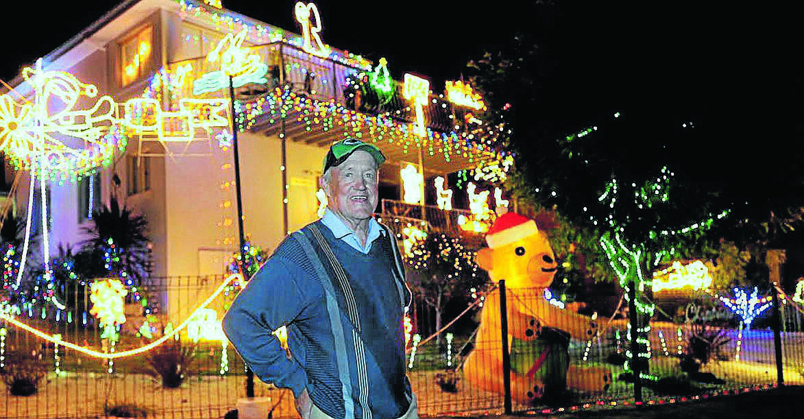 JINDABYNE: John McLoughlin with his Christmas light show. Photo: Steve Cuff.