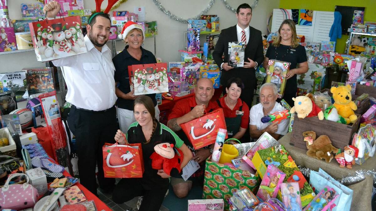 ULLADULLA: Liam Holland (left) and Linda Salafia from the Salvation Army thanked the community and local businesses including Karyn Coleman from Green Street Pre-school,  Michael Angland and Vikki   Sansom from Bunnings, Bob White from RBW Valuers, Joel Turner from First National Real Estate and Di Puglisi from NRMA for their generous donations to the Christmas toy drive.