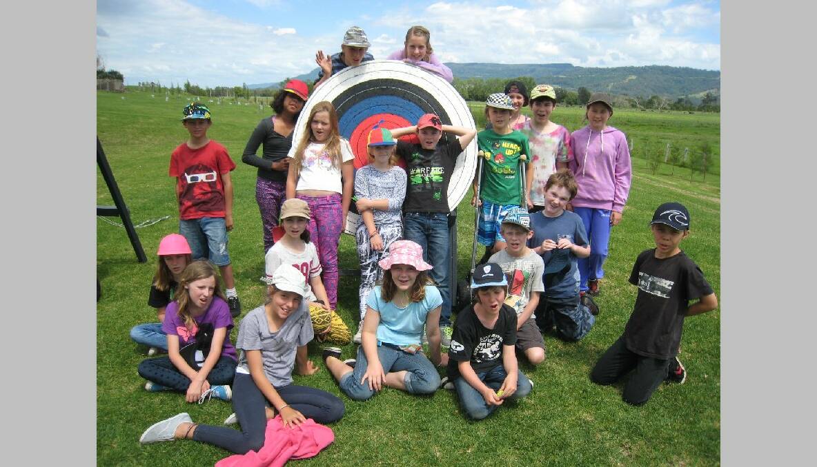 TILBA: Central Tilba primary class students gathered around an archery target at the Berry Sport and Recreation Centre.