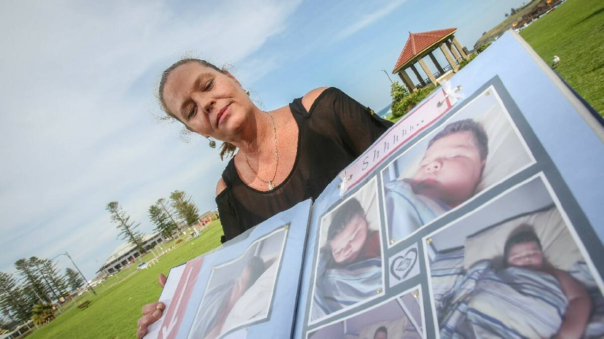 KIAMA: Mum Jodie Carr with her son Corey-Paul's album. Corey-Paul was killed when a relative ran over him. His mum has established  a foundation to try and prevent more deaths. Picture: DYLAN ROBINSON