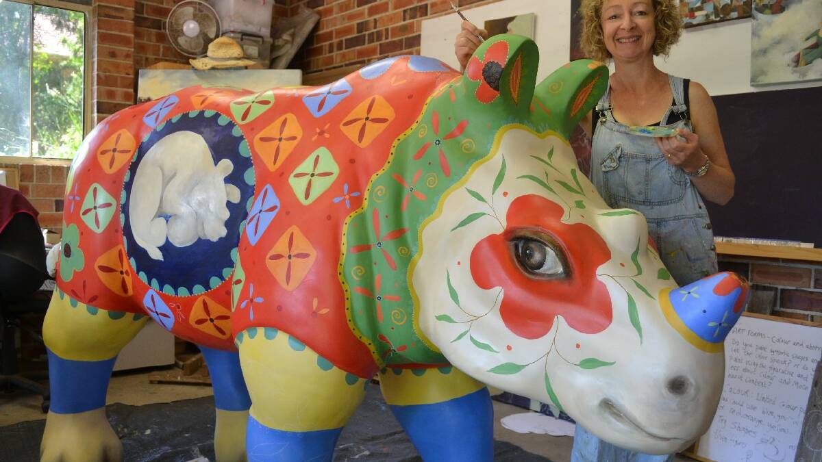  ULLADULLA: Artist Penny Lovelock works on her life-sized rhino sculpture which   will go on exhibition in Sydney in February before being auctioned to raise   funds for Taronga Zoo’s rhino conservation programs