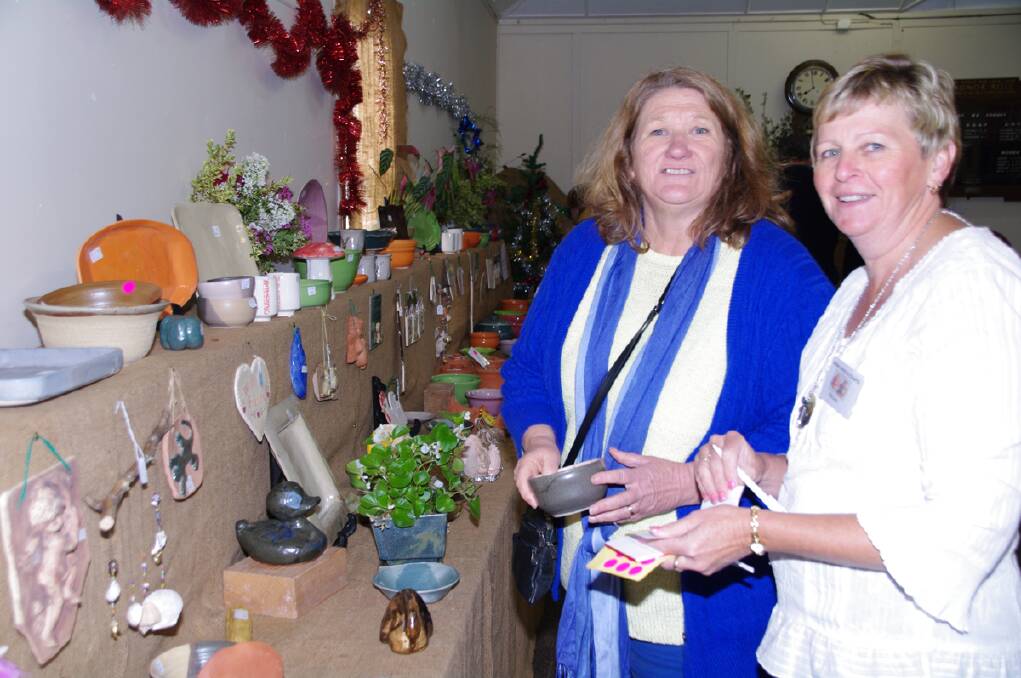 Moira Braden had Delma Robinson on stand-by to mark the treasures she had picked out at the famed Ando Art and Craft Sale on Sunday.  