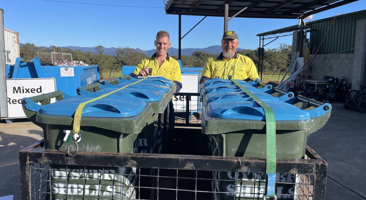 Lee and Nathan from Moruya transfer station loading the oyster bins retrofitted for Narooma Oyster Festival. Picture supplied.