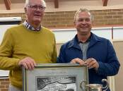 Re-elected Nowra Show Society president, James Thomson (right) accepts the Governor-General's Cup and photo of the winning District Exhibit of 1922 from Phil Monaghan. Picture by Wendy Woodward.