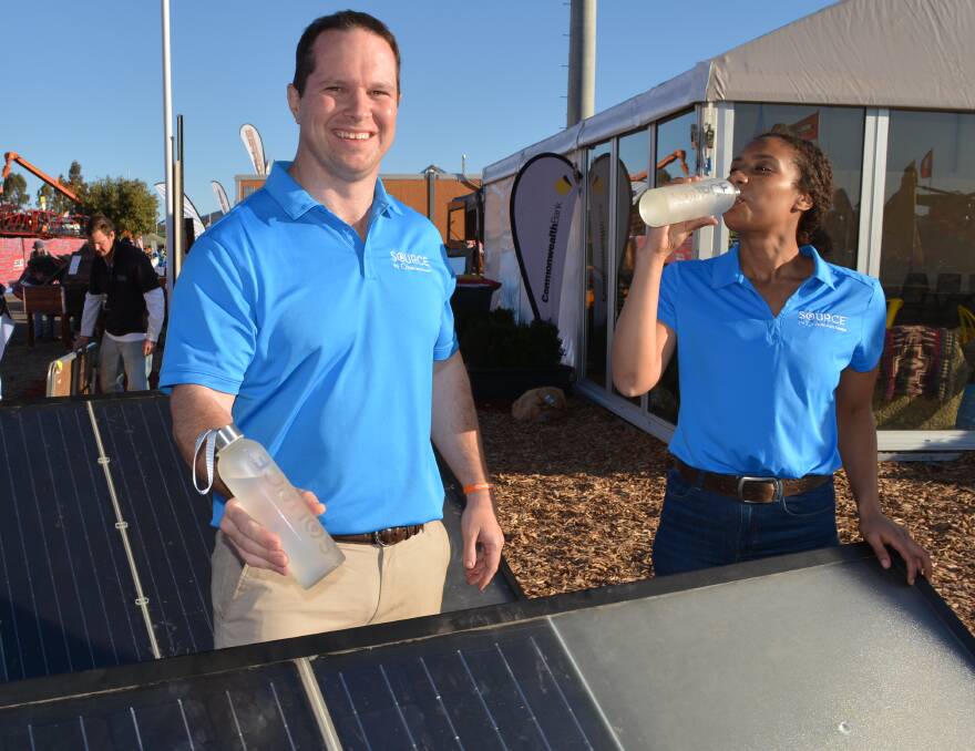 Zero Mass Water’s business development executive vice president, Rob Bartrop from Phoenix, Arizona and marketing manager, Nicole Ochan, Gold Coast, testing fresh water made under cloudless skies at  AgQuip field days in dry northern NSW.