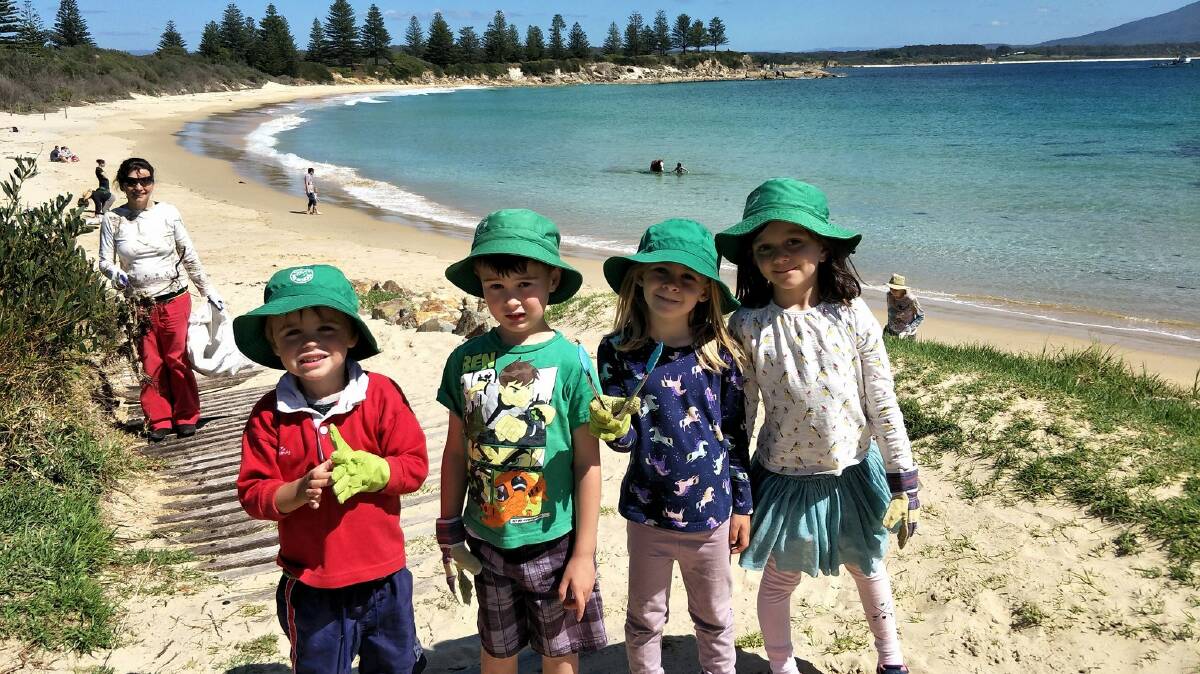 Bermagui Preschool children and Dorte Planert join in a recent beach clean-up with Our Coast Our Mission.