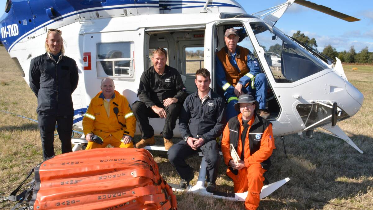 Members of the aerial attack and support crew for the Bemboka busfire Mitchell Van Der Meulen, air base manager Wayne Harrison, Brett Kiteley, Tom Lowry, Chilly and Jim Ryan. Picture: Ben Smyth
