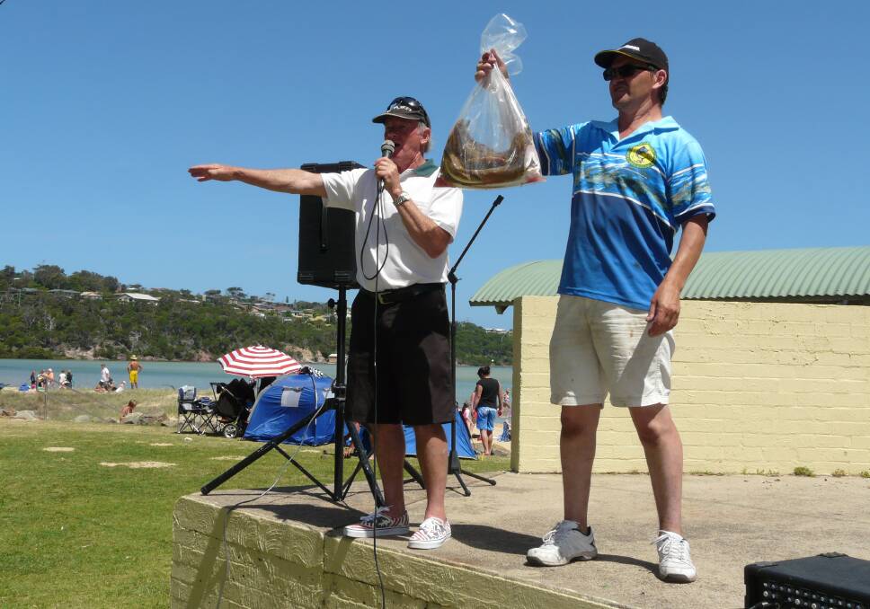 Auctioneer Robert Wood is assisted by Stuart Green holding a lovely bag of ocean flathead at last year's Spencer Park Monster Fish Auction.
