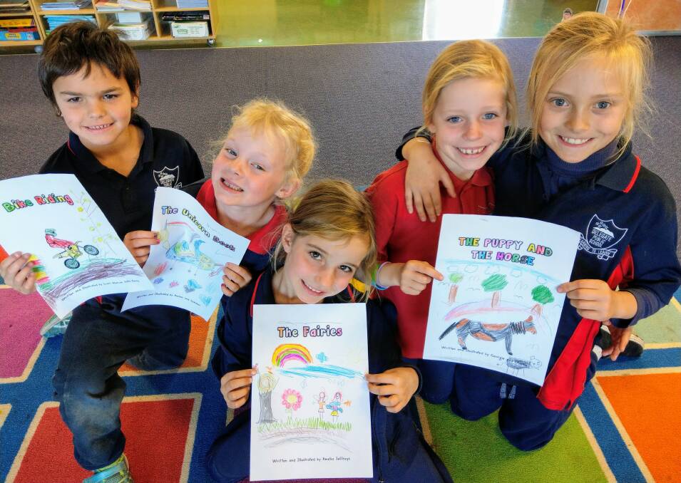 BUDDING AUTHORS: Delegate pupils Scott, Harlan, Amelia, Georgina and Charlie have been putting together storybooks ready to publish.