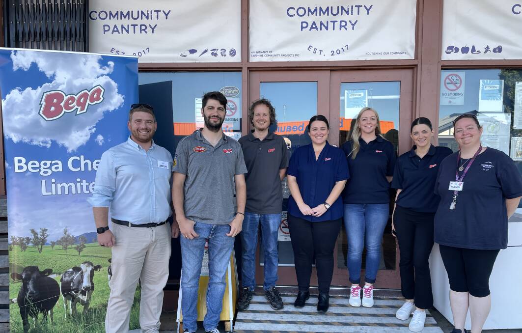 Celebrating the partnership are Sapphire Community Pantry president Josh Shoobridge (left) and manager Mandi Rush (right) with Bega Cheese employees Anthony Peroukaneas, Rowan Charnock, Hayley Driscoll, Emma Elmore and Adele Carrazza. Picture by Ben Smyth