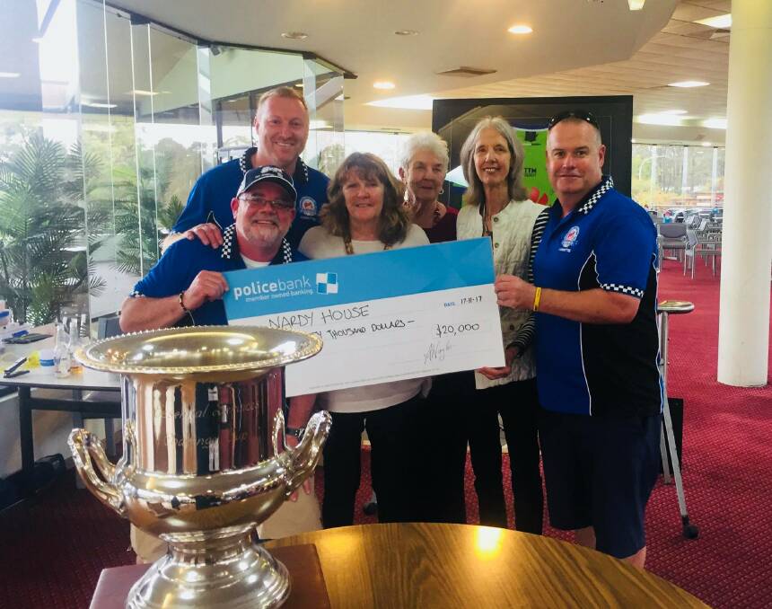 Emergency Services Golf Day committee members with the cheque following last year's event. They hope to raise money again for Nardy House.