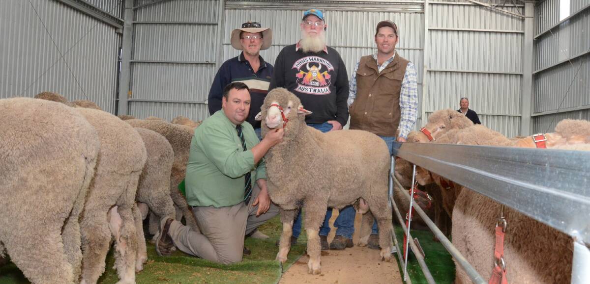 The Stewart family, Jindabyne, Ashford, bought 24 rams to $4500 averaging $2771, Warren, Dave and Dave (jnr), with their top ram held by Landmark's Brad Wilson.