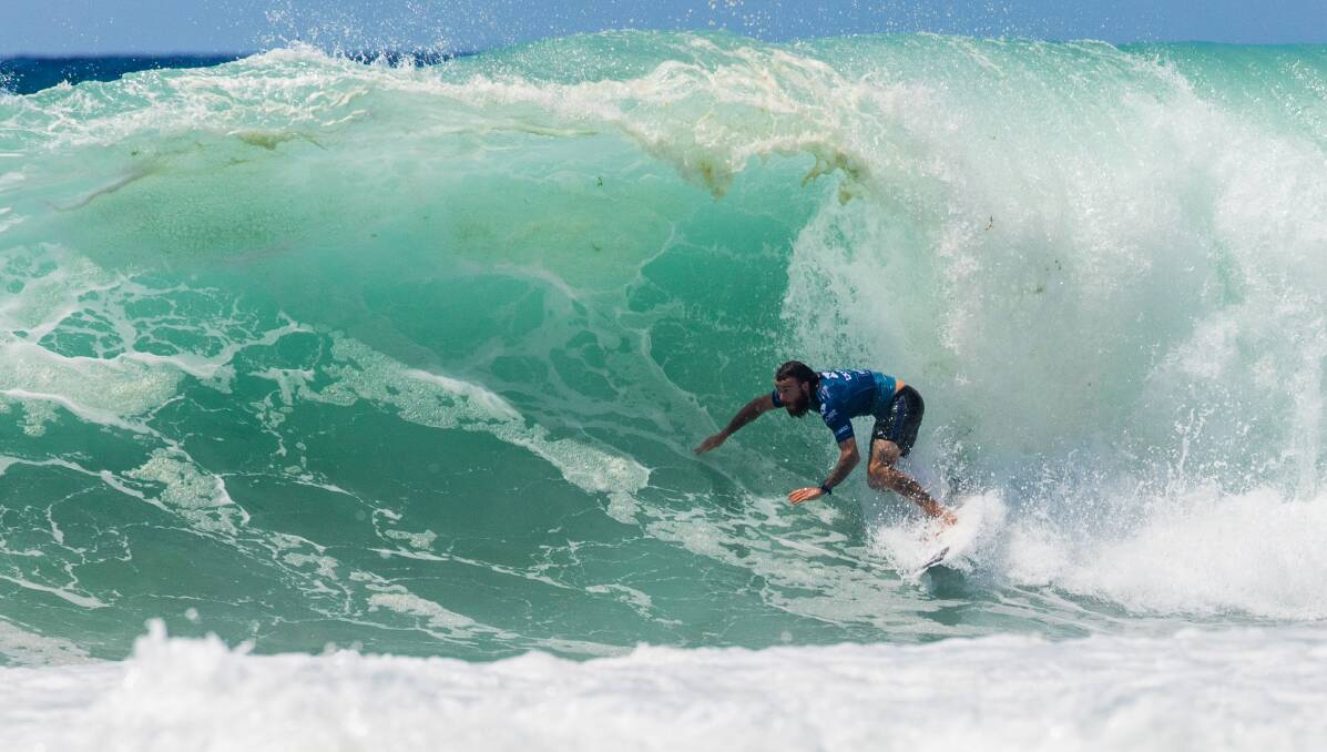 In his element: Culburra surfer Mikey Wright rides a wave while he was involved in a daring surf rescue on Oahu's north shore on the weekend. Picture: WSL/Cestari 