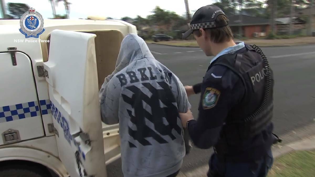Police arrest Kelly Percy at her home on Thursday. She is facing five counts of dishonestly obtaining a financial advantage by deception. Picture: NSW Police