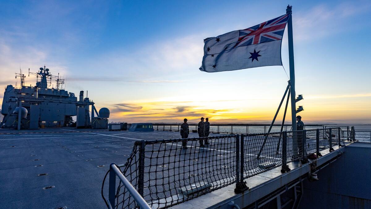 HMAS Choules during a sunset ceremony at the Port Of Brisbane, QLD. Picture Defence Images