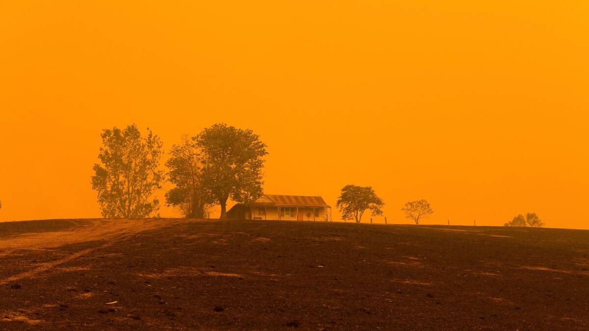 Familiar: The ominous orange skies that were common during the 2019-20 bushfires loom over a property near Cobargo. Picture: Ben Marden Photography. 