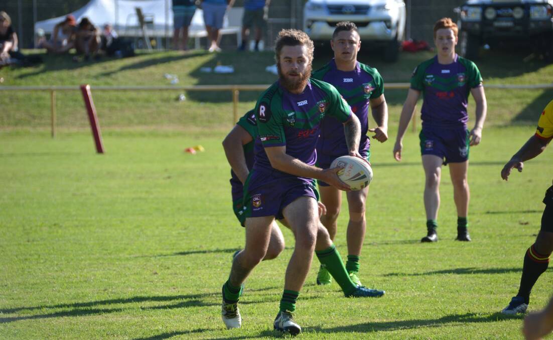 ALL STARS: Blake Schafer looks for an offload during the Indigenous v All Stars headline 23s clash at Narooma on Saturday. 