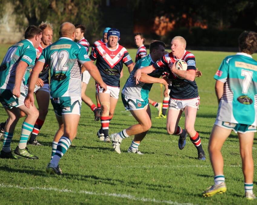 Lee Fuller charges out of the line for the Roosters in their reserve grade win over Candelo-Bemboka on Saturday. 