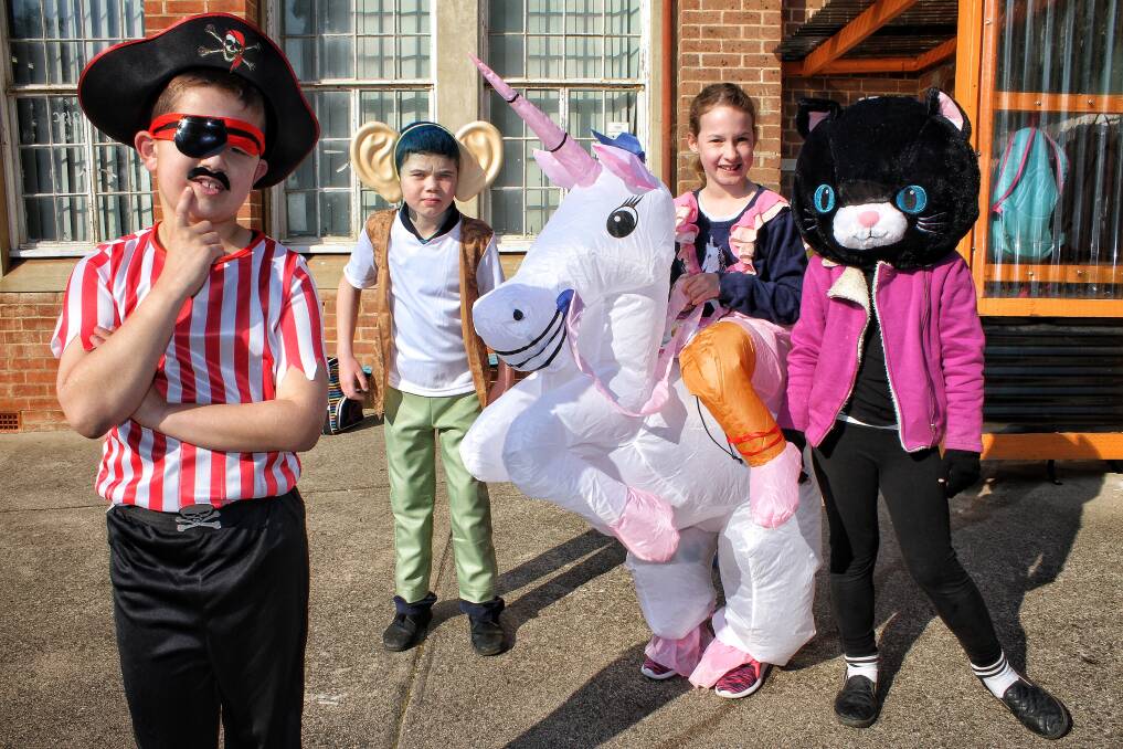 COSTUMES: St Patrick's Catholic Primary School pupils Sonny Abraham, Robert Smith and sisters Tiah and Amy Spencer on Thursday. Picture: Alasdair McDonald