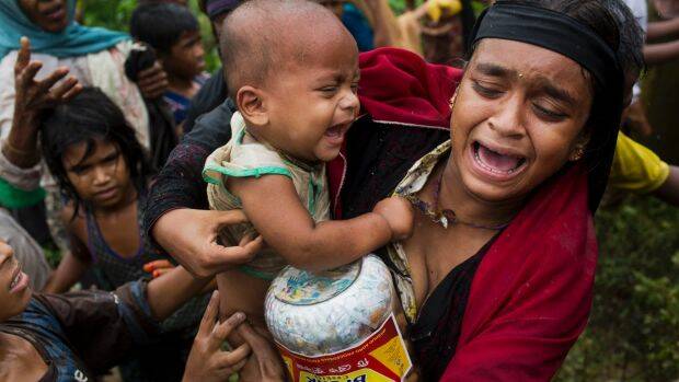 A Rohingya woman after a fight erupted during food distribution at a refugee camp in Kutupalong, Bangladesh. Photo: AP