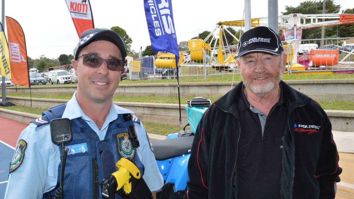 Bombala police officer Senior Constable Steve Gay chatting to Terrance McGufficke of Jindabyne at the Bombala Show on Saturday.